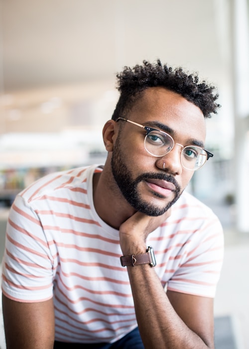 Young man in casual attire smiling